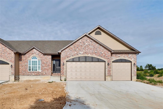 ranch-style home featuring a garage