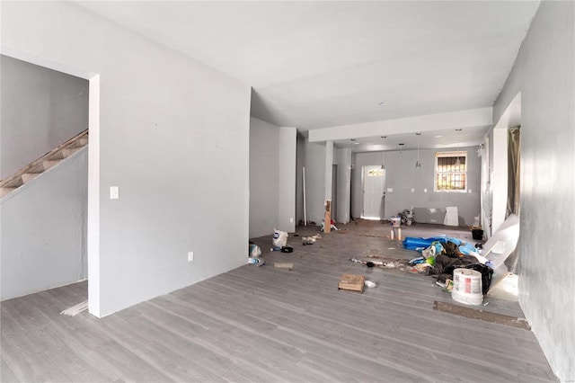 unfurnished living room with wood-type flooring