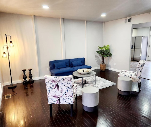 living room featuring dark hardwood / wood-style flooring