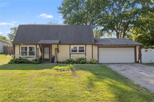 view of front facade featuring a front yard and a garage