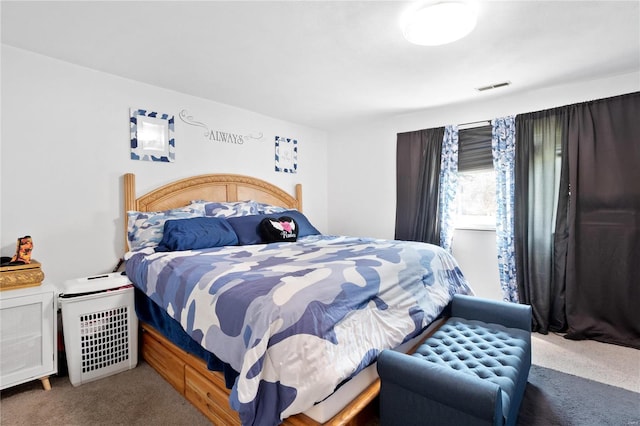 bedroom featuring dark colored carpet