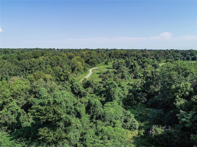 aerial view featuring a view of trees