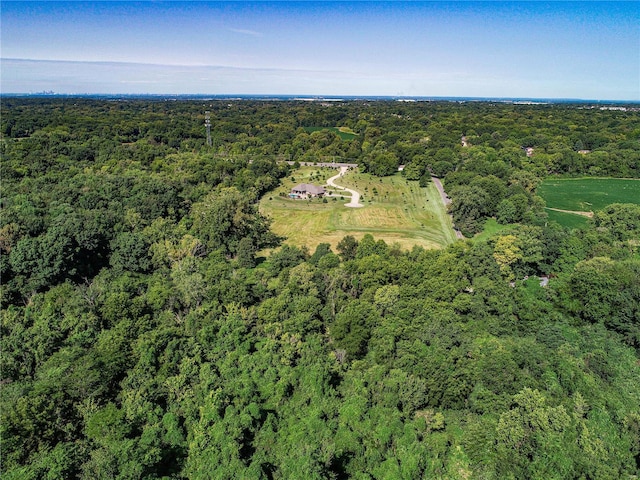 drone / aerial view featuring a view of trees