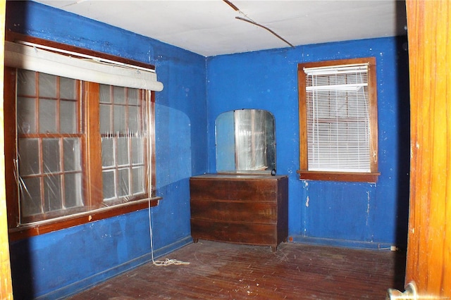 spare room with dark wood-type flooring