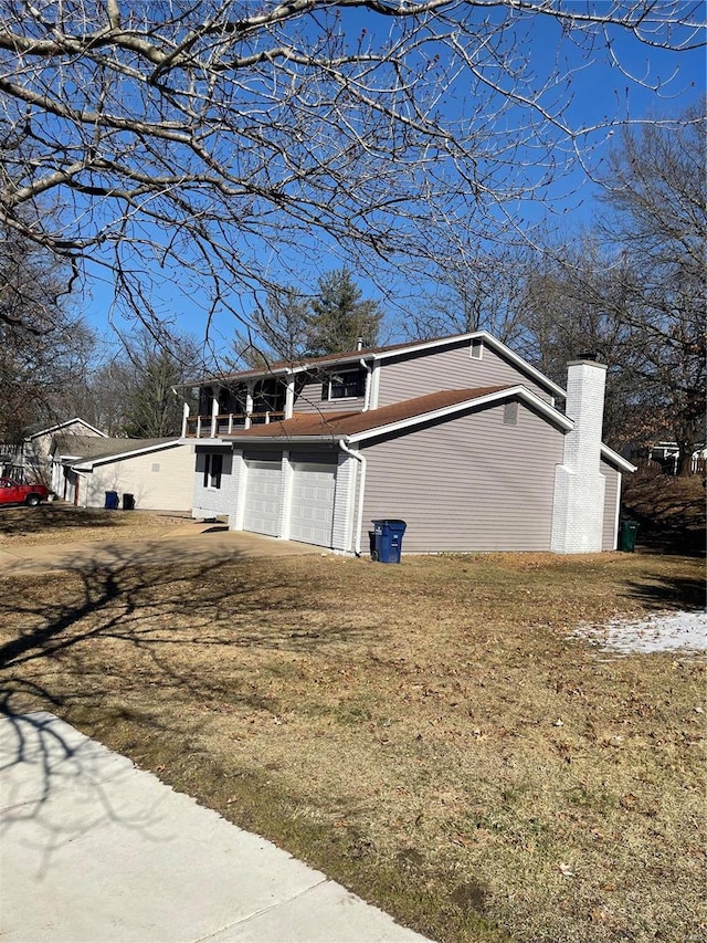 view of side of home with a garage