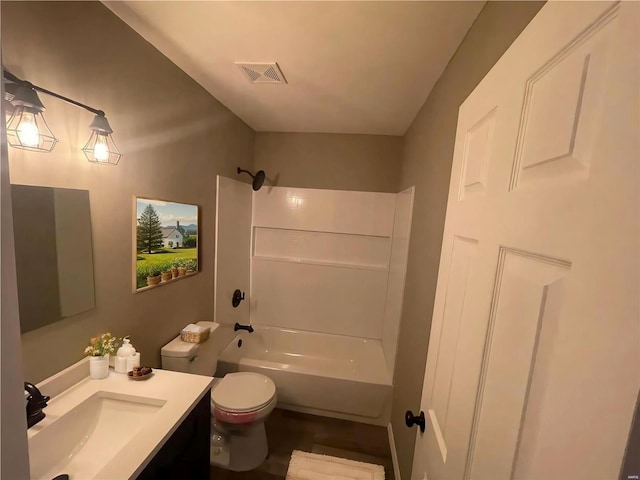 full bathroom featuring toilet, vanity, and shower / bathing tub combination