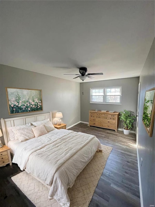 bedroom featuring hardwood / wood-style flooring and ceiling fan