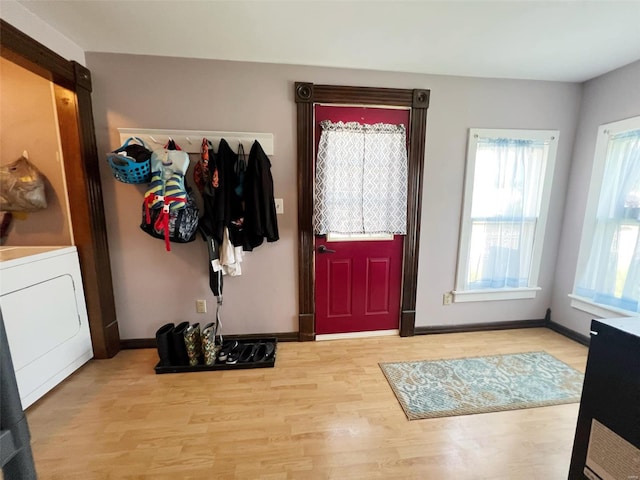 entryway featuring washer / dryer and light wood-type flooring