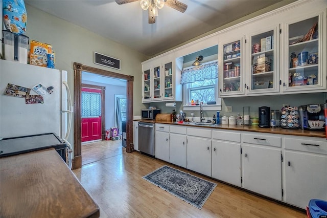 kitchen with white cabinetry, dishwasher, sink, white refrigerator, and light wood-type flooring