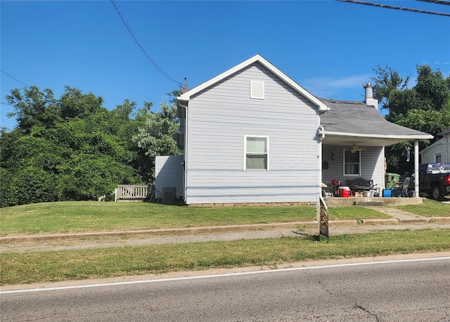 view of home's exterior featuring a yard