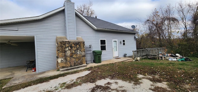 rear view of property with a chimney