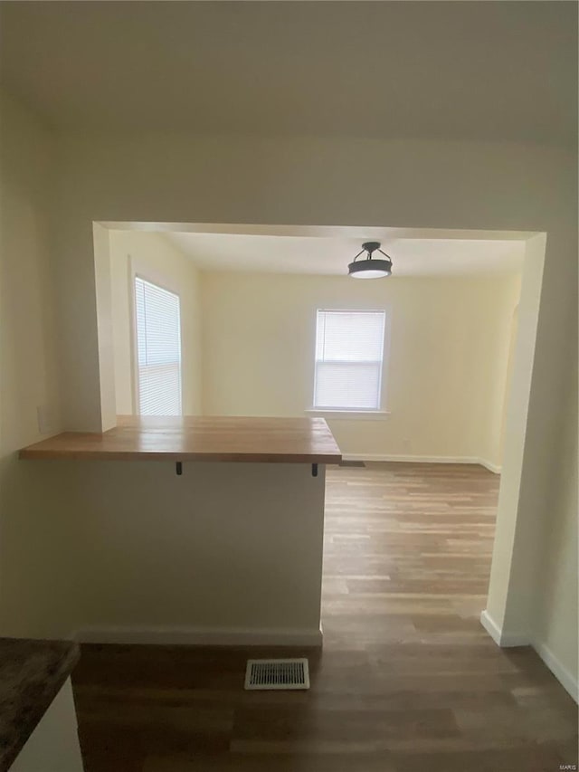 corridor featuring hardwood / wood-style flooring