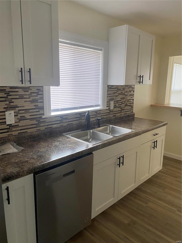 kitchen featuring dark wood-type flooring, white cabinetry, sink, and stainless steel dishwasher