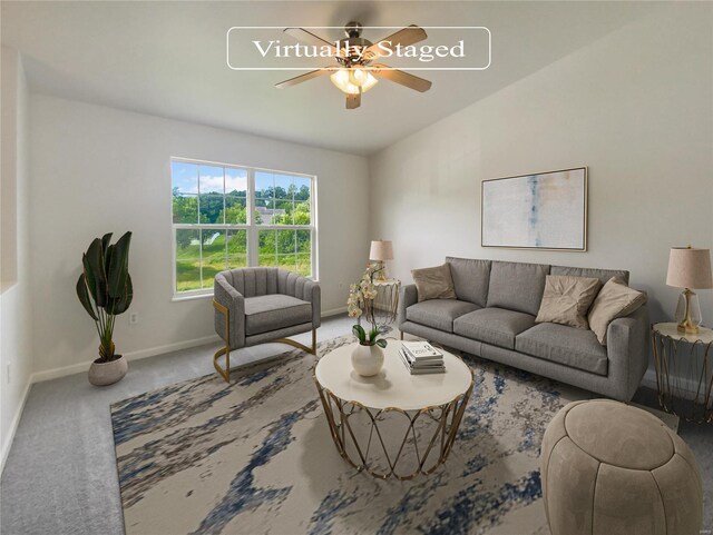 carpeted living room with ceiling fan