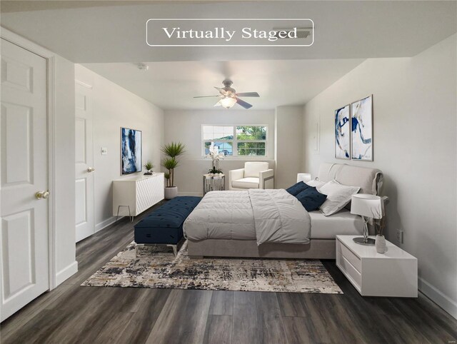 bedroom featuring ceiling fan and dark hardwood / wood-style flooring