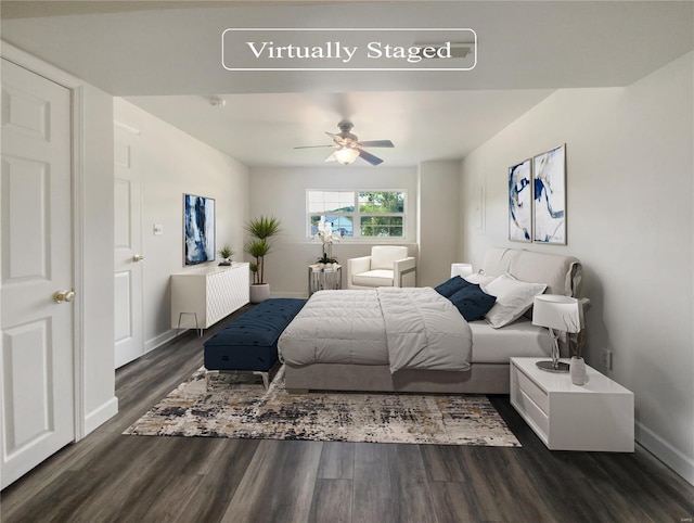 bedroom with ceiling fan and dark hardwood / wood-style flooring