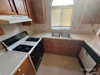 kitchen featuring white appliances and sink