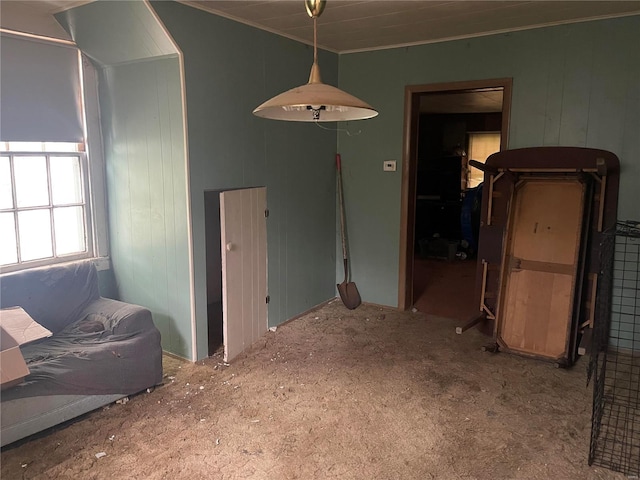 interior space featuring crown molding and carpet floors