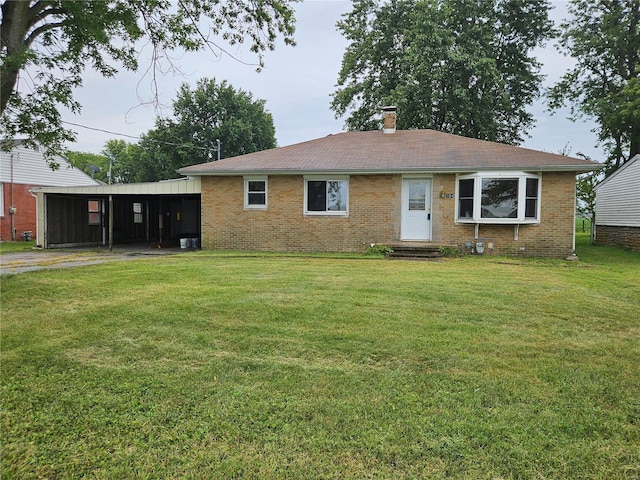 ranch-style house featuring a front lawn, a chimney, and brick siding