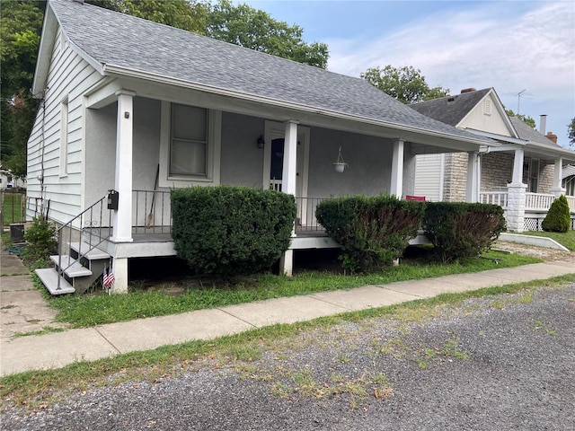 view of front of home featuring central AC unit and a porch