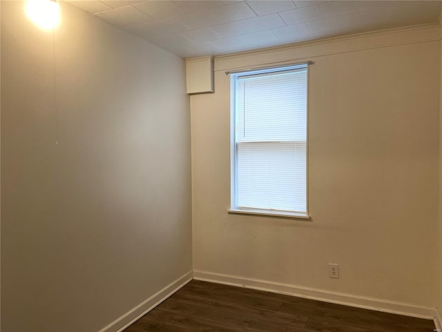 empty room featuring dark wood-type flooring