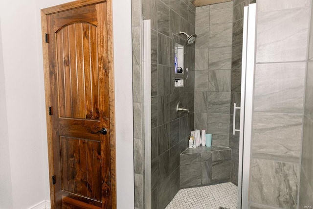 bathroom with a tile shower