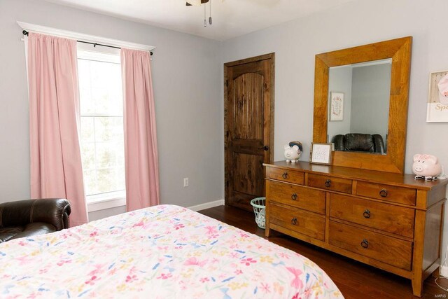 bedroom featuring ceiling fan and dark hardwood / wood-style floors