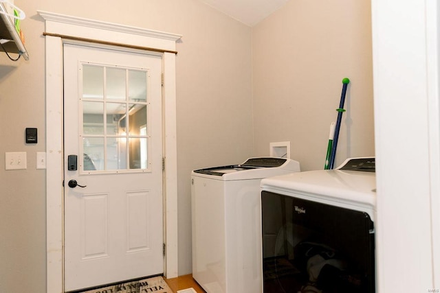 laundry room with laundry area and washer and clothes dryer