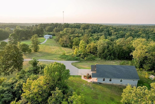 drone / aerial view with a view of trees