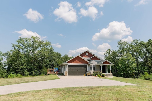 craftsman inspired home with a front yard and a garage