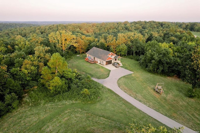 bird's eye view featuring a forest view