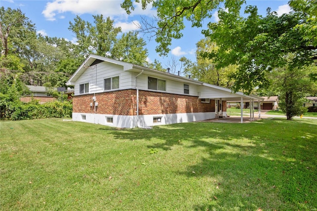 view of home's exterior with a lawn and a patio area