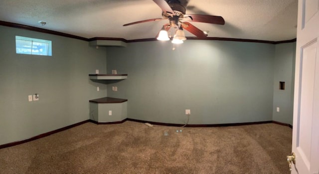 interior space with crown molding, a textured ceiling, carpet floors, and ceiling fan