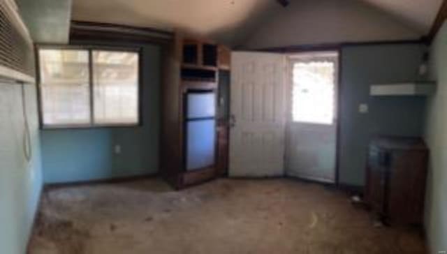 interior space featuring lofted ceiling