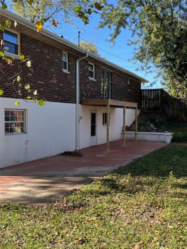 rear view of property featuring a patio