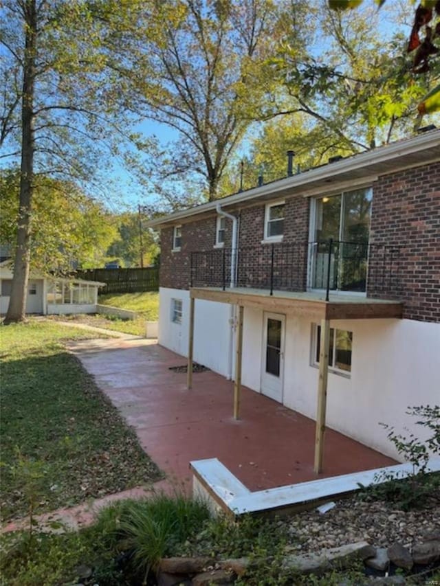 back of property with a patio