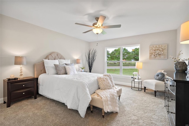 bedroom featuring ceiling fan and light colored carpet