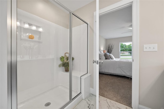 bathroom featuring ceiling fan, tile patterned flooring, and an enclosed shower