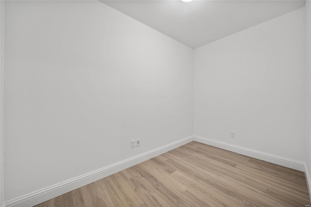 spare room with light hardwood / wood-style flooring