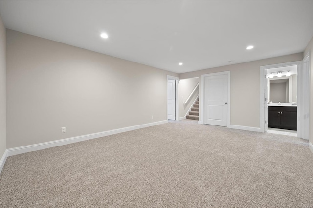 unfurnished room with light colored carpet