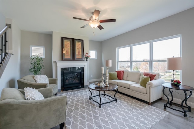 living room with ceiling fan and hardwood / wood-style flooring