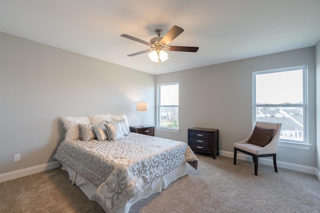 bedroom featuring ceiling fan and light colored carpet