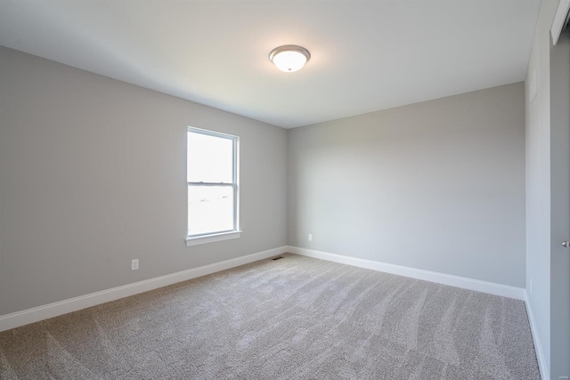 empty room featuring carpet floors