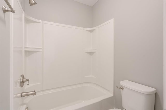 bathroom with shower / bathtub combination and toilet