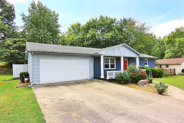 ranch-style home featuring a garage and a front yard