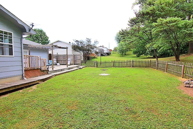 view of yard featuring a wooden deck