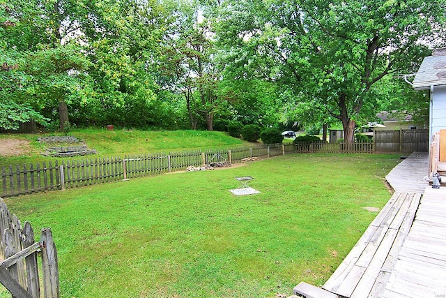 view of yard with a wooden deck