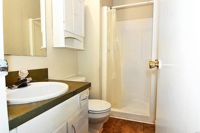 bathroom featuring curtained shower, vanity, toilet, and tile patterned flooring