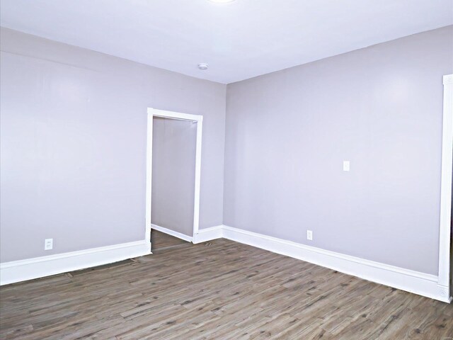 spare room with hardwood / wood-style flooring