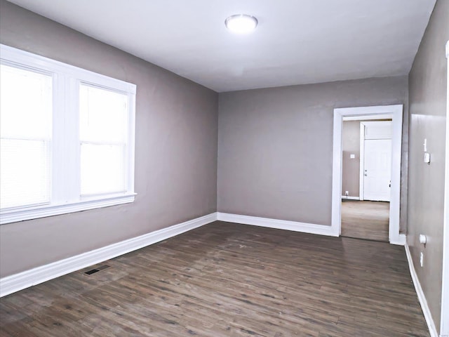 unfurnished room featuring wood-type flooring